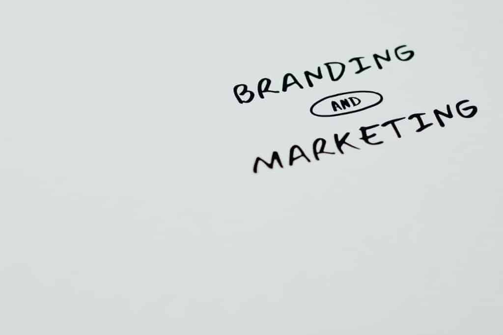 "Branding and Marketing" handwritten text on whiteboard