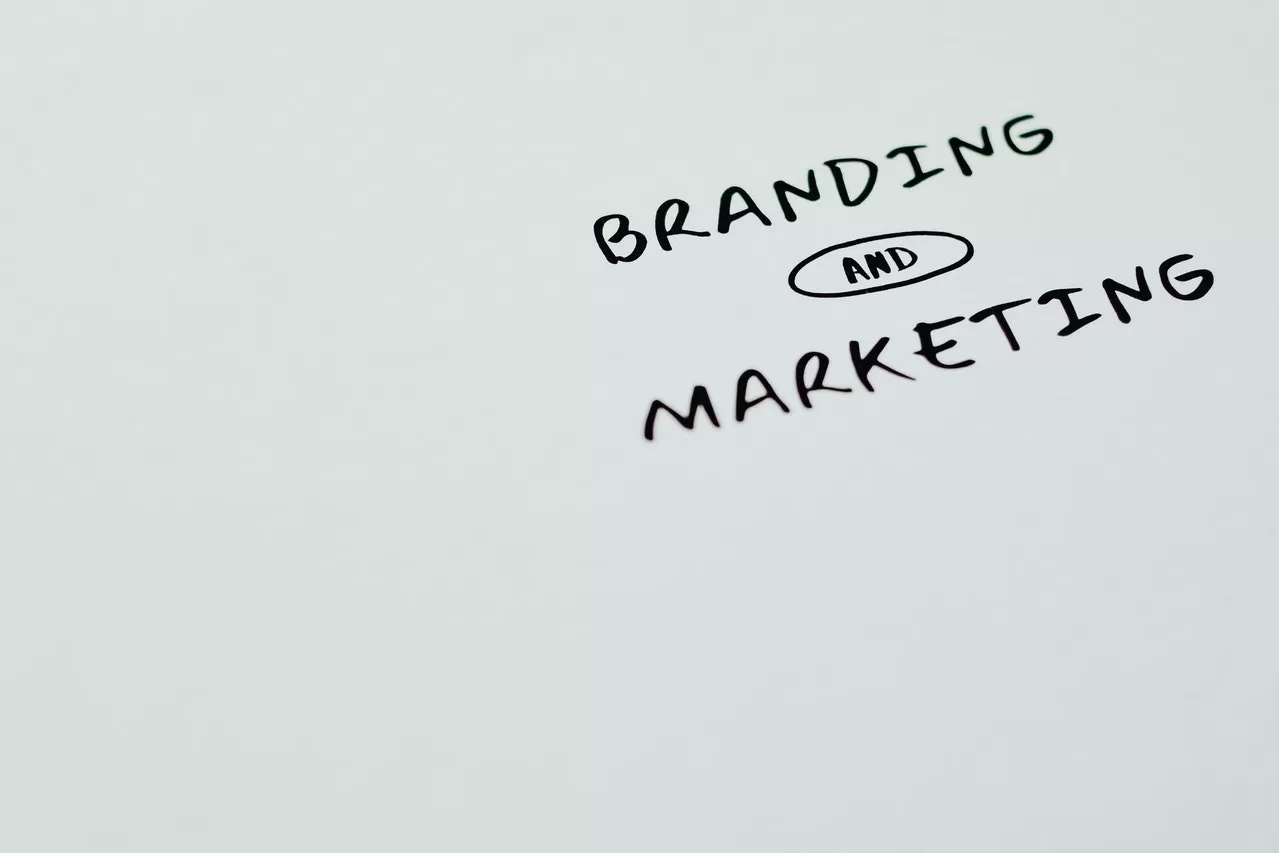 "Branding and Marketing" handwritten text on whiteboard