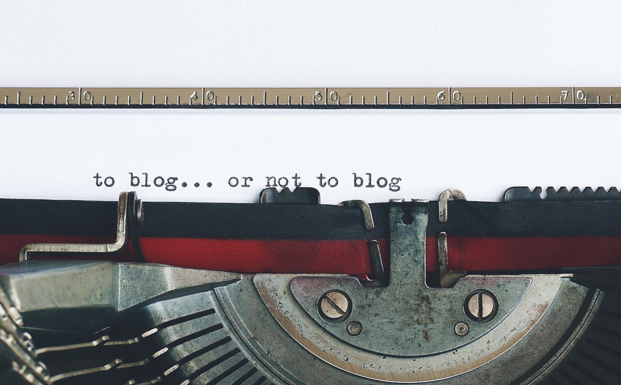 Text String "To blog... or not to blog" written by a typewriter